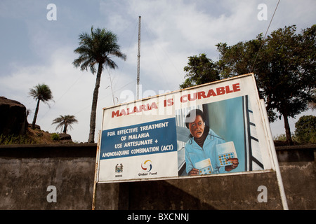 A malaria public service announcement sits along a street in Freetown, Sierra Leone, West Africa. Stock Photo