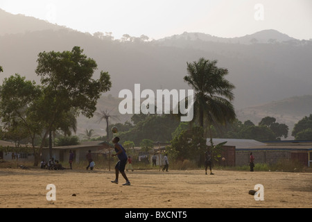 Villagers play football together in the town of Hastings in Sierra Leone, West Africa. Stock Photo