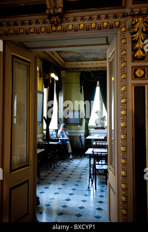 Ornate gilded doorway leading to restaurant with a marble floor at the National Theatre in San Jose Stock Photo