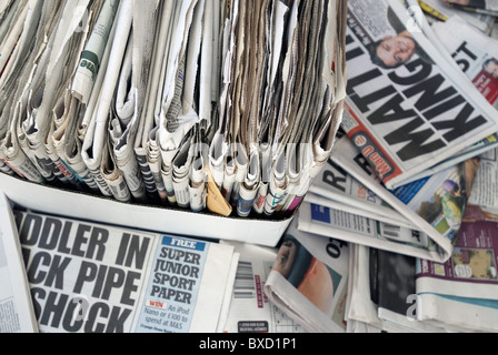 pile of old newspapers ready for recycling in the uk Stock Photo - Alamy