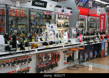 Various Sony and Canon cameras and lenses for sale in Bic camera store in Tokyo Japan 2010 Stock Photo