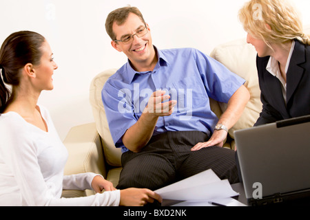 Business group are discussing business at a meeting Stock Photo