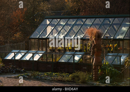 Green house and coldframes in the Fruit and Vegetable garden at RHS Rosemoor in November, Devon, England, United Kingdom Stock Photo