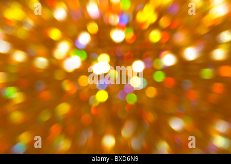 Abstract pattern of coloured lights blurred and out of focus