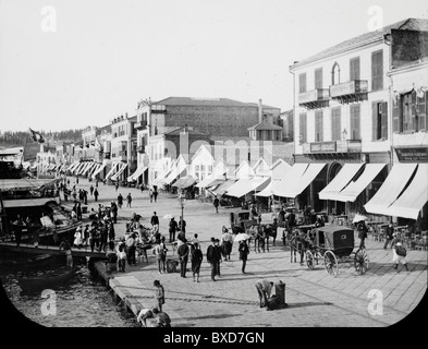Waterfront, Quay, Quayside or Seafront with Pavement Cafes or Sidewalk Cafes at Smyrna (now Izmir) Turkey c1910 Stock Photo