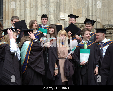 graduates from York St John University celebrating their success outside York Minster, York, England, UK Stock Photo