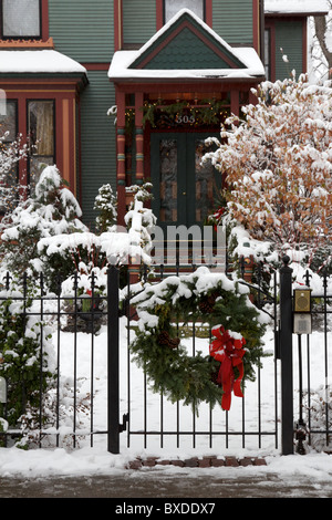 Christmas wreath on gate in front of house. Oak Park, Illinois. Stock Photo