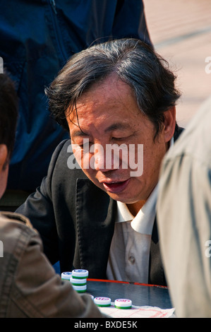 Asian man playing board game in Hong Kong China Stock Photo