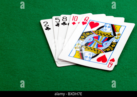 High card poker hand on green background Stock Photo