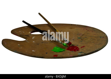 Two brushes on a palette with green and red paint. Isolated on white Stock Photo