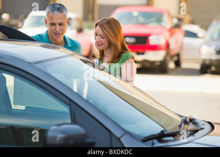 Couple shopping for a new car Stock Photo