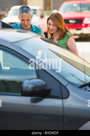 Couple shopping for a new car Stock Photo
