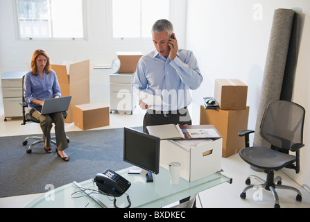 Business entrepreneurs working in startup office Stock Photo