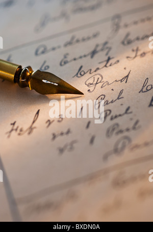 Antique pen on top of list Stock Photo