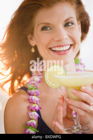 Woman drinking a frozen cocktail Stock Photo