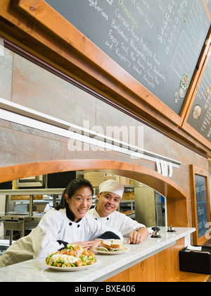 Chefs in restaurant Stock Photo