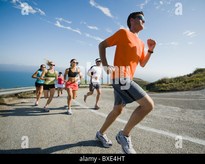 Runners on a road in Malibu Stock Photo