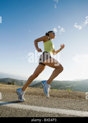 Runner training on a road in Malibu Stock Photo