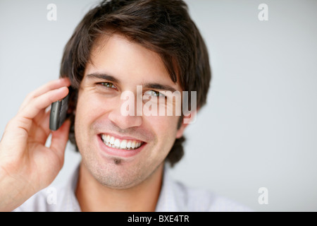 Handsome man talking on cell phone Stock Photo