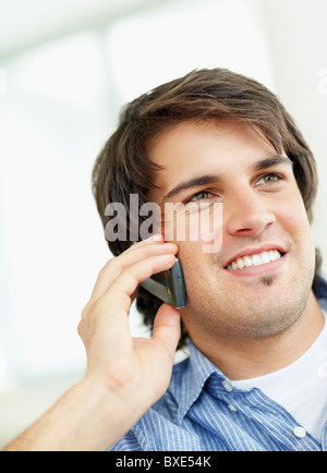 Handsome man talking on cell phone Stock Photo