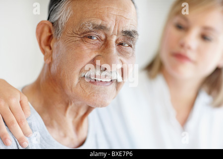 Nurse caring for senior patient Stock Photo