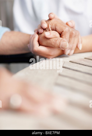 two people holding hands Stock Photo