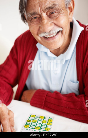 Senior man playing bingo Stock Photo