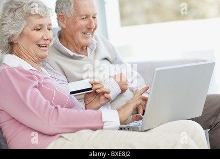 Senior couple shopping online Stock Photo