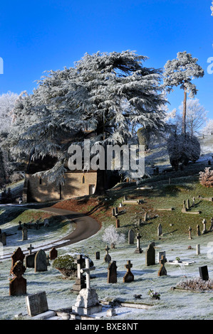 Graveyard coverd in hoarfrost and snow Stock Photo