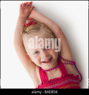 Cute young girl lying down Stock Photo