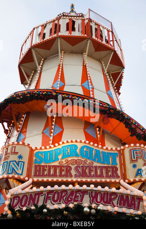 Traditional helter skelter at a fairground in Glasgow, Scotland set up for the Christmas carnival Stock Photo