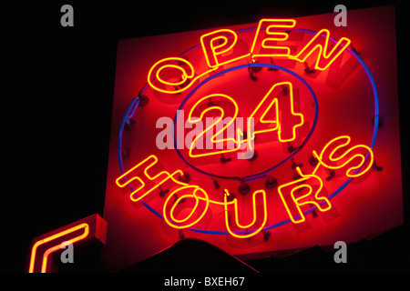Illuminated open 24 hours sign Stock Photo