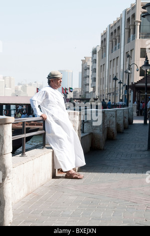 a man in a traditional white dress in Dubai Stock Photo