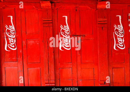 Nepal - Kathmandu Valley - Bhaktapur - Coca Cola advertisement painted on a door Stock Photo