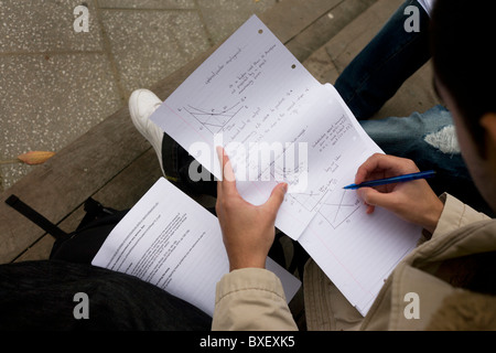 A student studies maths outside at London Metropolitan University's Holloway Road campus.