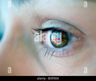 Logo from Youtube video sharing website reflected in an eye Stock Photo