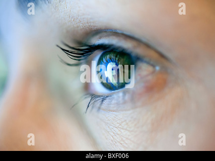 Reflection in an eye of logo from Facebook social media website Stock Photo