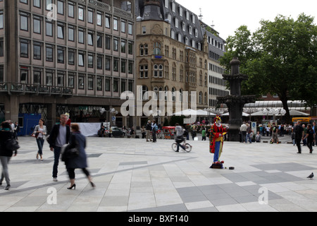 People crossing the square in front of the Dom of Cologne Stock Photo
