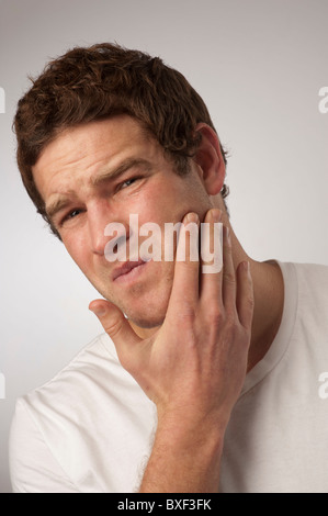 white caucasian male man suffering toothache Stock Photo