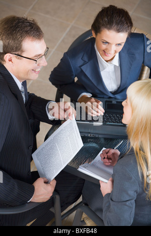 Portrait of three businesspeople discussing a new important project Stock Photo
