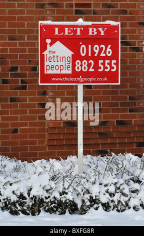 Estate agents board in winter, UK Stock Photo