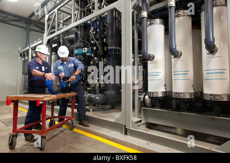 Engineers who specialize in water treatment working at a privately owned municipal water treatment plant near San Antonio, Texas Stock Photo