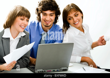 Portrait of business persons gathered together discussing an idea Stock Photo