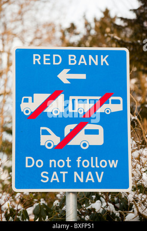 A sign in Grasmere banning heavy vehicles from using the steep and narrow Red Bank road after lorries using sat nav got stuck. Stock Photo