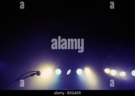 Microphone and spotlights on stage Stock Photo