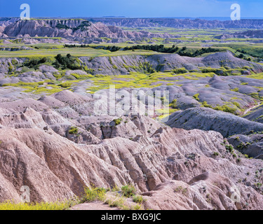 Eroded formations and distant storm, late afternoon, Badlands Wilderness area, Badlands National Park, South Dakota, USA Stock Photo
