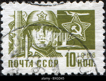 UNION OF SOVIET SOCIALIST REPUBLICS - CIRCA 1966: A stamp printed in the USSR shows soldier, circa 1966 Stock Photo