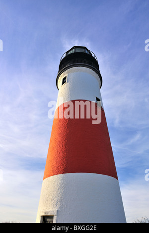 Dramatic wide-angle view looking up at Sankaty Head Light Lighthouse Nantucket, Massachusetts, USA Red and white stripe Stock Photo