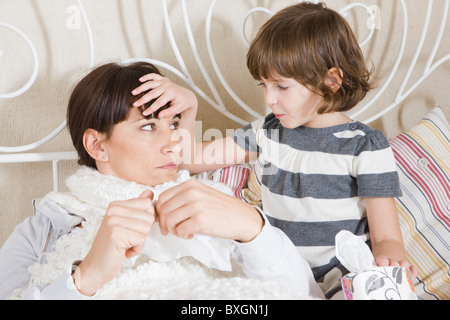 Mother care, worry about her sick daughter on hospital bed with her ...