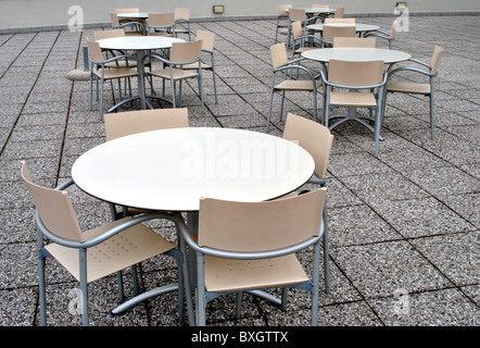 modern bar tables and chairs made of plastic and aluminum floor rocks Stock Photo